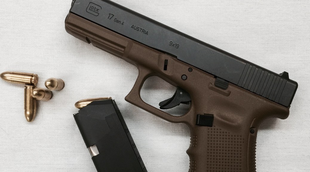 GLOCK G17 Gen4 in Flat Dark Earth with one magazine and a few 9x19mm Parabellum cartridges.